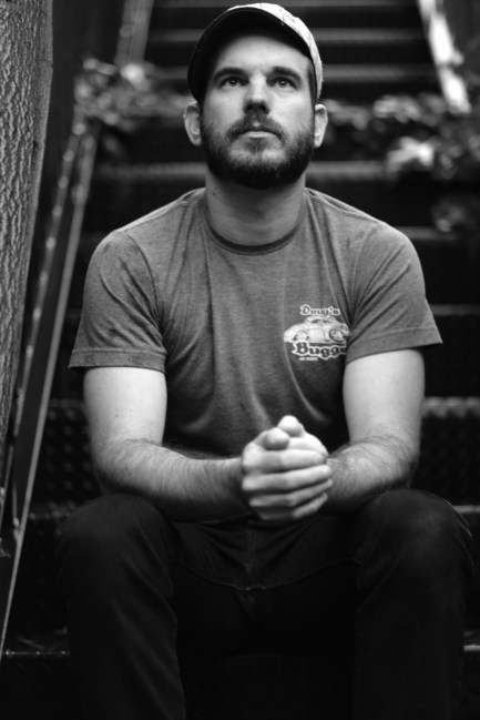 #34 B&W Morrissey shot, sitting on outside stairs.JPG